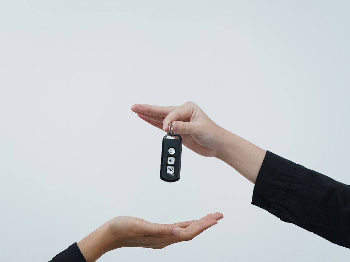 Car key being handed over